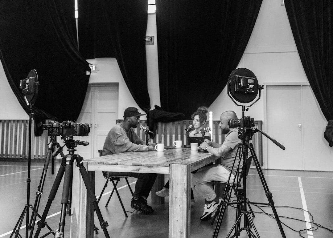 Diverse journalism team having an editorial meeting around a table